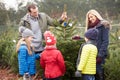 Outdoor Family Choosing Christmas Tree Together Royalty Free Stock Photo