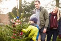 Outdoor Family Choosing Christmas Tree Together Royalty Free Stock Photo