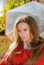 Outdoor fashion close up portrait of young beautiful sensual woman in Autumn park with umbrella