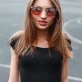 Outdoor fashion closeup portrait of young pretty woman n sunglasses. Royalty Free Stock Photo