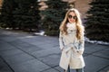 Outdoor fashion closeup portrait of young pretty woman in sunglases walking on street Royalty Free Stock Photo