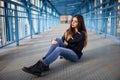 Outdoor fashion lifestyle portrait of pretty young girl, wearing in hipster swag grunge style urban background. Tomboy city Royalty Free Stock Photo