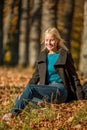 Outdoor fashion photo of young beautiful lady in a birch forest. Royalty Free Stock Photo