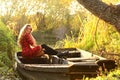 Outdoor fashion photo of young beautiful lady surrounded autumn leaves Royalty Free Stock Photo