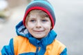 Outdoor fashion portrait of adorable little kid boy wearing colorful clothes Royalty Free Stock Photo