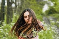 Outdoor fashion portrait of elegant lady in pink stylish dress.