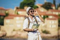 Portrait of handsome stylish tourist man posing at the beach