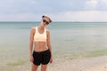 Outdoor fashion portrait summer beach style of young beautiful woman fresh face smiling on the beach of tropic island having fun o Royalty Free Stock Photo