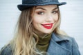 Outdoor fashion portrait of young beautiful fashionable woman wearing stylish accessories.vintage hat,looking at camera Royalty Free Stock Photo
