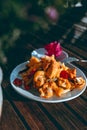 An Outdoor Feast: Spicy Baked Curry Chicken with Roasted Cauliflower and Red Bell Pepper