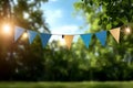 Outdoor festive bunting decor with blue and yellow flags hanging on string lights Royalty Free Stock Photo