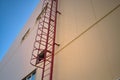 Outdoor fire escape ladder on industrial building wall Royalty Free Stock Photo