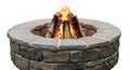 Outdoor fire pit surrounded by stone and brick for cozy evening gatherings Royalty Free Stock Photo
