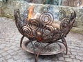 Outdoor fire place in an iron basket Royalty Free Stock Photo