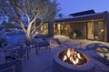 Outdoor fire place by a pool Royalty Free Stock Photo