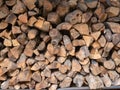 Outdoor firewood pile in overcast outdoor building, close up Royalty Free Stock Photo