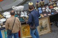 outdoor flea market in Paris set up on tables at the edge of the Seine.