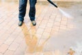 Outdoor floor cleaning with high pressure water jet - cleaning c Royalty Free Stock Photo