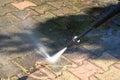 Outdoor floor cleaning with high pressure water jet Royalty Free Stock Photo