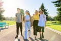 Outdoor, four teenagers walking together on road
