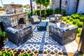 Outdoor Front Patio With Four Wicker Chairs With Cushions And Lattice Overhang