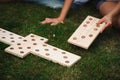 Outdoor games - dominoes in the park on the green grass.