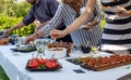 Outdoor garden party with buffet table full of canapes. Royalty Free Stock Photo