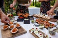 Outdoor garden party with buffet table full of canapes. Royalty Free Stock Photo