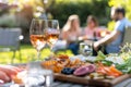 Outdoor garden party with friends enjoying food and drinks Royalty Free Stock Photo