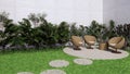 outdoor garden sofa from bamboo with nature small tree and beautiful grass Royalty Free Stock Photo