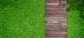 Top view green artificial grass with wooden footpath in garden. Royalty Free Stock Photo