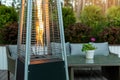 Outdoor gas pyramid heater working on terrace Royalty Free Stock Photo