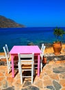 Outdoor greek tavern with pink table(Crete)
