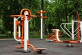 Empty outdoor gym with air walker, ovate stepper, twister and surfer