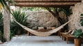 Bohemian Patio Hammock Relaxation Area with Stone Wall and Tropical Plants Royalty Free Stock Photo