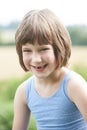 Outdoor Head And Shoulders Portrait Of Smiling Girl