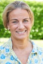 Outdoor Head And Shoulders Portrait Of Mature Woman