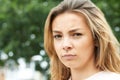 Outdoor Head And Shoulders Portrait Of Serious Teenage Girl