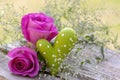Outdoor holiday decoration with pink roses and green heart Royalty Free Stock Photo