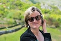 Outdoor holliday portrait of a happy thirty year old woman