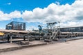 Outdoor incline large conveyor with rubber belt conveyor for transportation line for processing the coal in the coal mine. Royalty Free Stock Photo