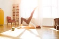 Woman stretching in room at home. Healthy and sport lifestyle. Fitness sport girl doing yoga fitness exercise. Royalty Free Stock Photo