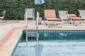 Outdoor inground residential swimming pool in backyard View on swimming pool Royalty Free Stock Photo