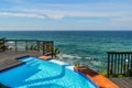 Outdoor jacuzzi and luxurious spa bath and infinity pool along Atlantic ocean in Ballito South Africa Royalty Free Stock Photo