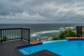 Outdoor jacuzzi and luxurious spa bath and infinity pool along Atlantic ocean in Ballito South Africa Royalty Free Stock Photo