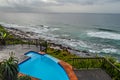 Outdoor jacuzzi and luxurious spa bath and infinity pool along Atlantic ocean in Ballito South Africa Royalty Free Stock Photo