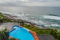 Outdoor jacuzzi and luxurious spa bath and infinity pool along Atlantic ocean in Ballito South Africa Royalty Free Stock Photo