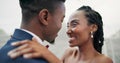 Outdoor, kiss and black couple with marriage, wedding and hug with happiness, romance and celebration. African man