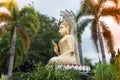 Outdoor large golden sitting Buddha in Buddhist temple.