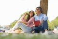 Outdoor Leisure. Happy Mature Spouses Reading Books While Relaxing Together In Park Royalty Free Stock Photo